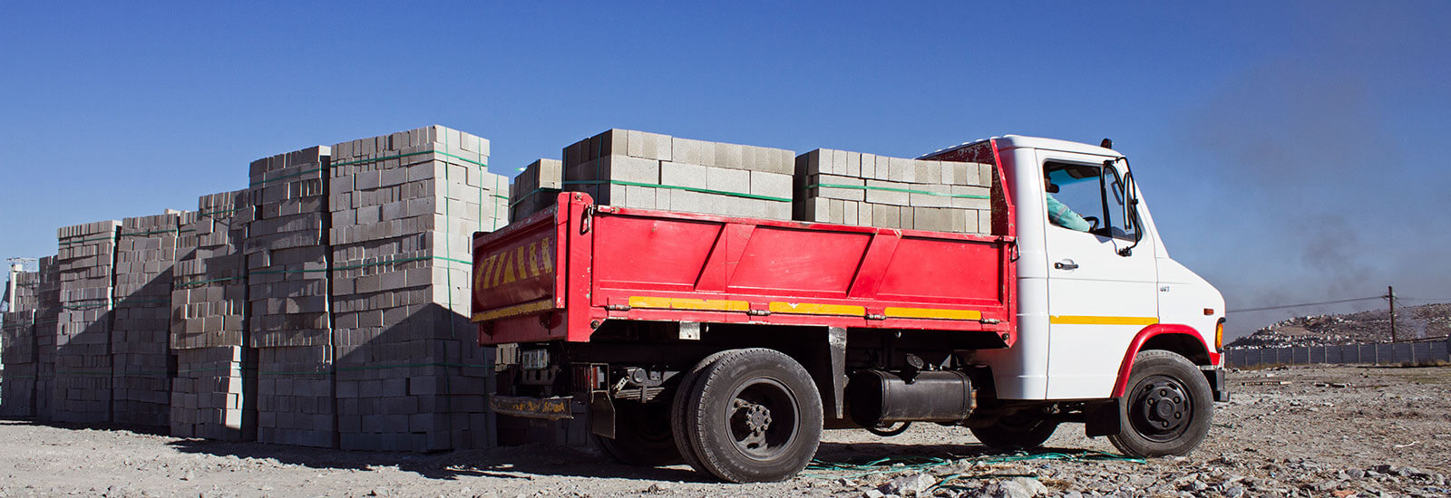 Mini Build Truck loading bricks on site